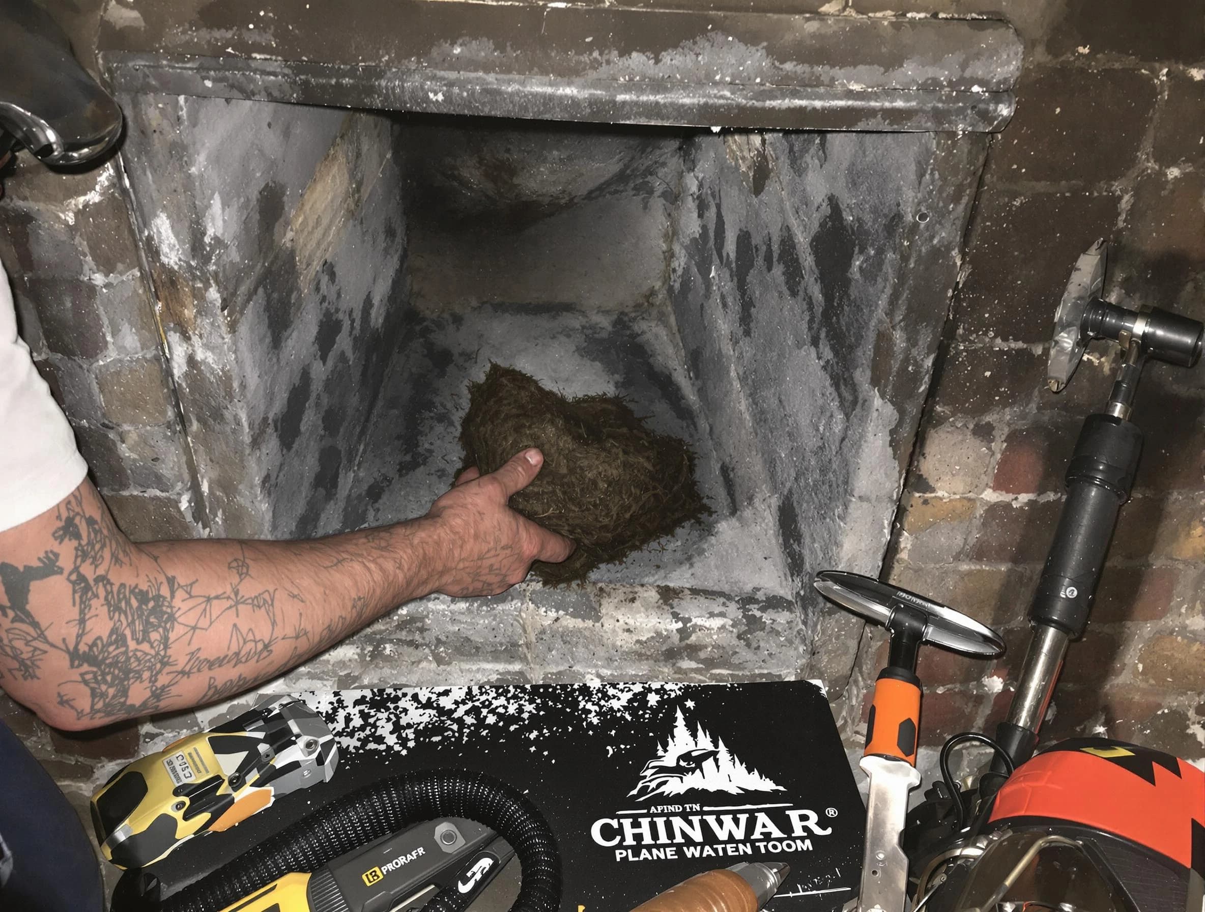 Holly Springs Chimney Sweep safely removing debris and screening chimney in Holly Springs, GA